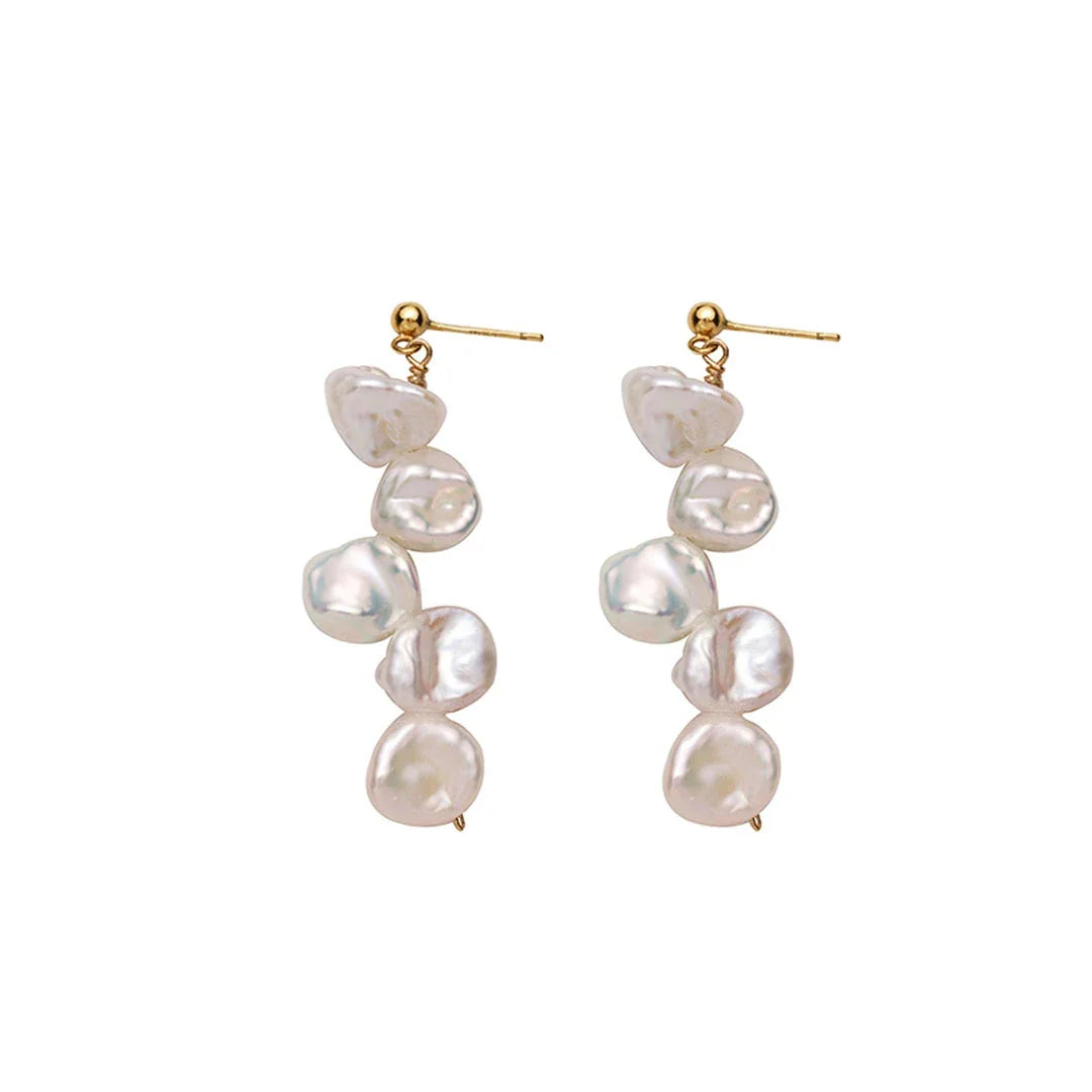 Pair of natural baroque pearl earrings with spiral clip design, featuring uniquely formed pearls in a shimmering display