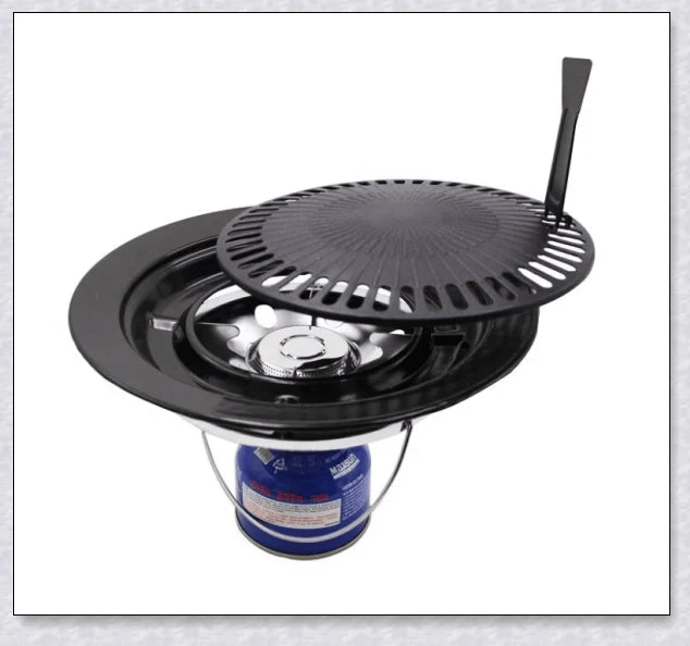 Hunters Creek Portable Korean Outdoor Barbecue Gas Grill Pan with various cooking accessories, including a baking tray, kettle, and pot