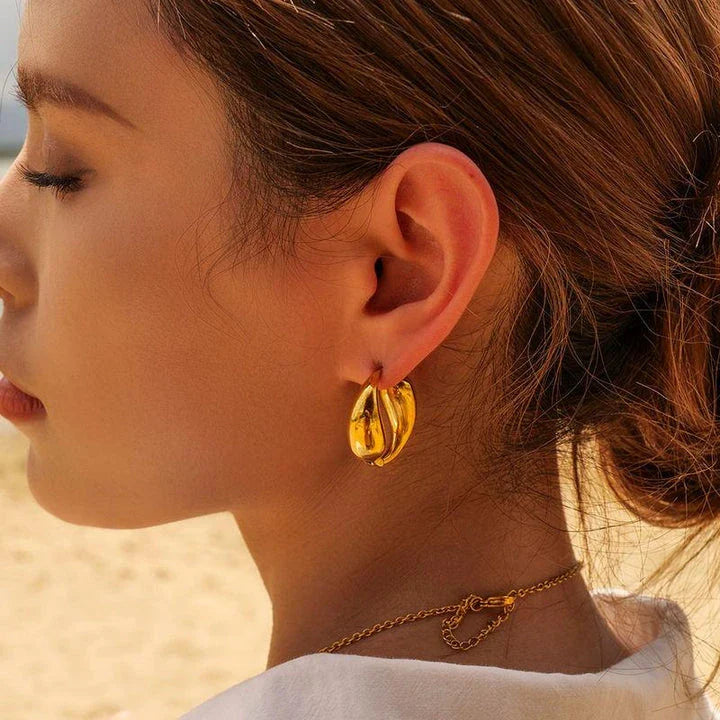 Elegant 18K gold-plated stainless steel water drop earrings with a vintage O-shaped pendant, designed for timeless style and everyday wear.