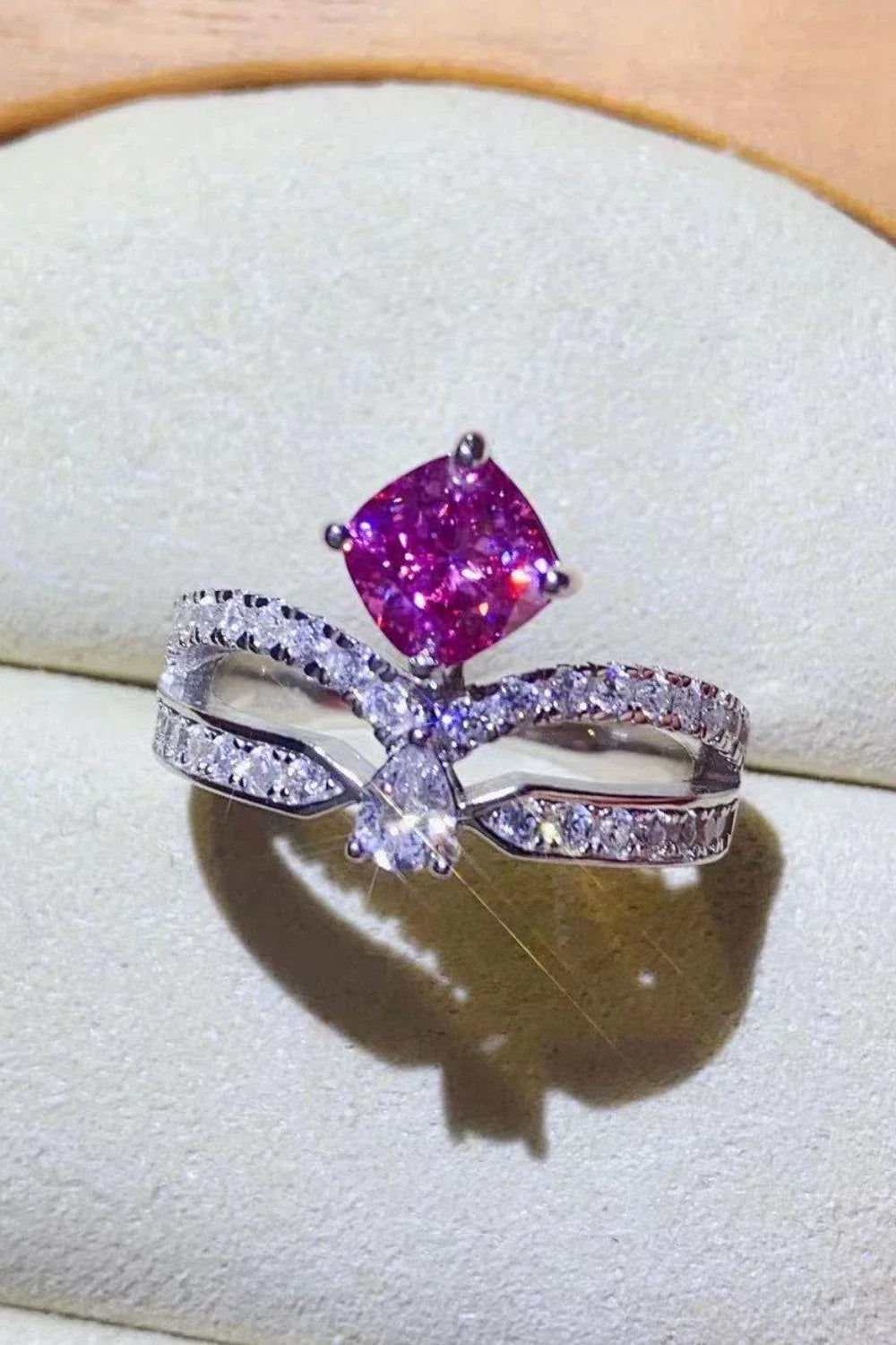 Elegant 1 carat moissanite ring in fuchsia pink, featuring a minimalist design and a lustrous platinum-plated finish