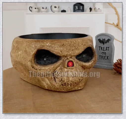 Pumpkin-shaped candy bowl with a creepy moving skeleton hand that jumps out to startle guests, ideal for Halloween decorations and parties.