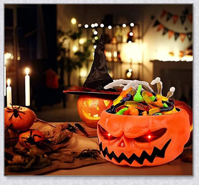 Pumpkin-shaped candy bowl with a creepy moving skeleton hand that jumps out to startle guests, ideal for Halloween decorations and parties.
