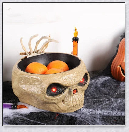 Pumpkin-shaped candy bowl with a creepy moving skeleton hand that jumps out to startle guests, ideal for Halloween decorations and parties.