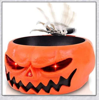Pumpkin-shaped candy bowl with a creepy moving skeleton hand that jumps out to startle guests, ideal for Halloween decorations and parties.
