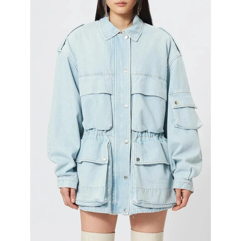 Model wearing a stylish patchwork denim jacket with practical pockets and a refined collar design