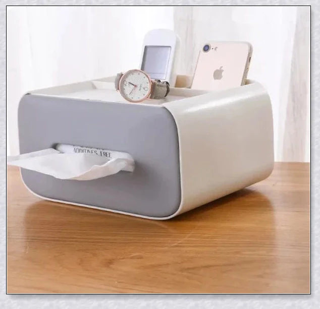 A Nordic-inspired tissue box with multiple storage compartments for organising everyday items like tissues, remote controls, and makeup