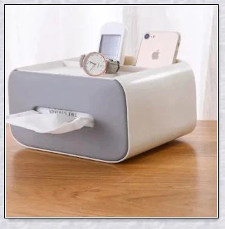 A Nordic-inspired tissue box with multiple storage compartments for organising everyday items like tissues, remote controls, and makeup