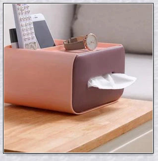 A Nordic-inspired tissue box with multiple storage compartments for organising everyday items like tissues, remote controls, and makeup