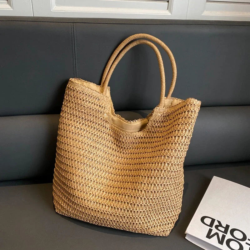 A stylish and spacious straw tote bag in brown and beige colours, perfect for British women on the go.