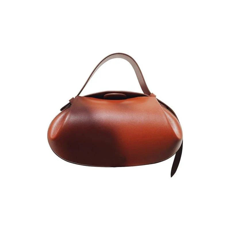 Elegant round vegan leather handbag with a distinctive circular shape, durable construction, and spacious interior organisation