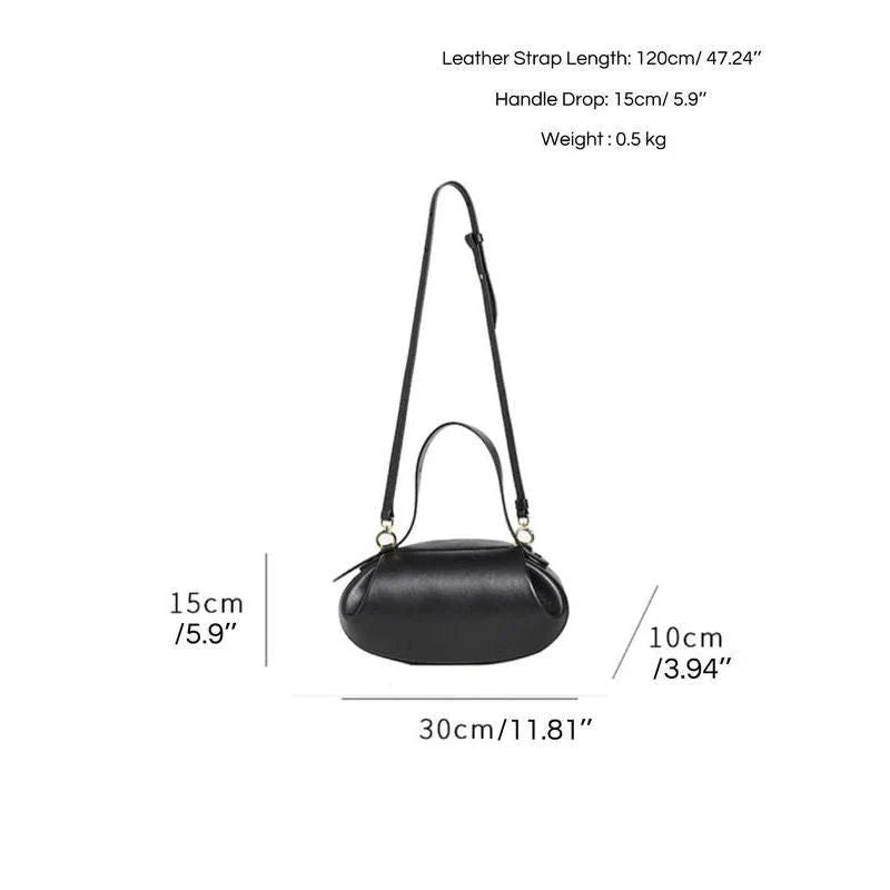 Elegant round vegan leather handbag with a distinctive circular shape, durable construction, and spacious interior organisation