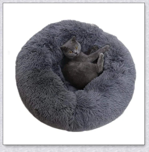 Round and raised cat marshmallow bed in white and grey colours, designed to promote healthy and restful sleep for cats