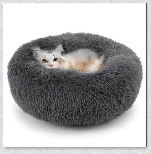 Round and raised cat marshmallow bed in white and grey colours, designed to promote healthy and restful sleep for cats