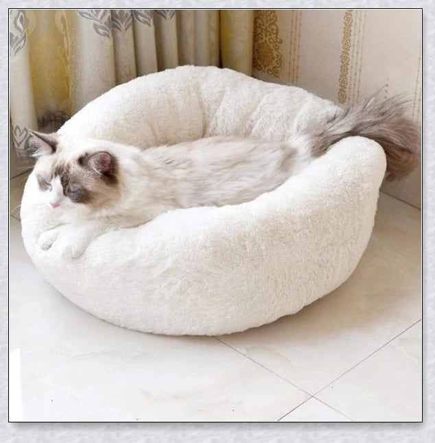 Round and raised cat marshmallow bed in white and grey colours, designed to promote healthy and restful sleep for cats