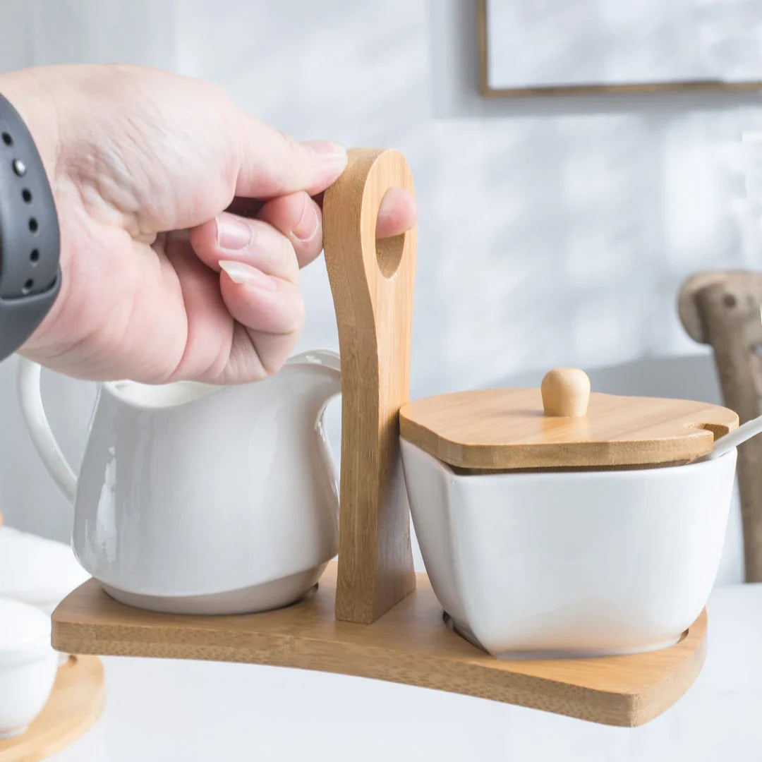 A set of elegant white ceramic sugar and milk pots for serving coffee with sophistication