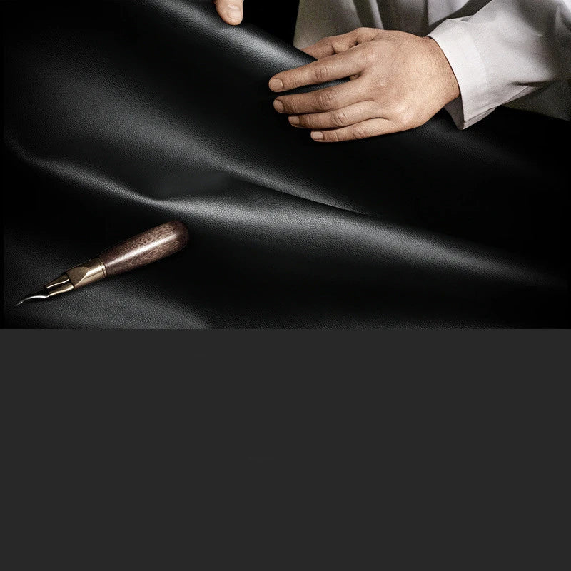 A high-quality genuine leather backpack with a sleek, sophisticated design, perfect for the discerning gentleman
