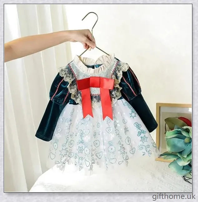 A cosy and stylish autumn lace Christmas dress for baby girls, available in a range of festive colours.