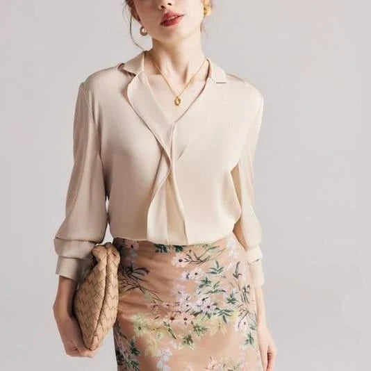 Elegant ruffled v-neck silk blouse in a champagne colour, featuring a straight and regular fit design for a timeless look.