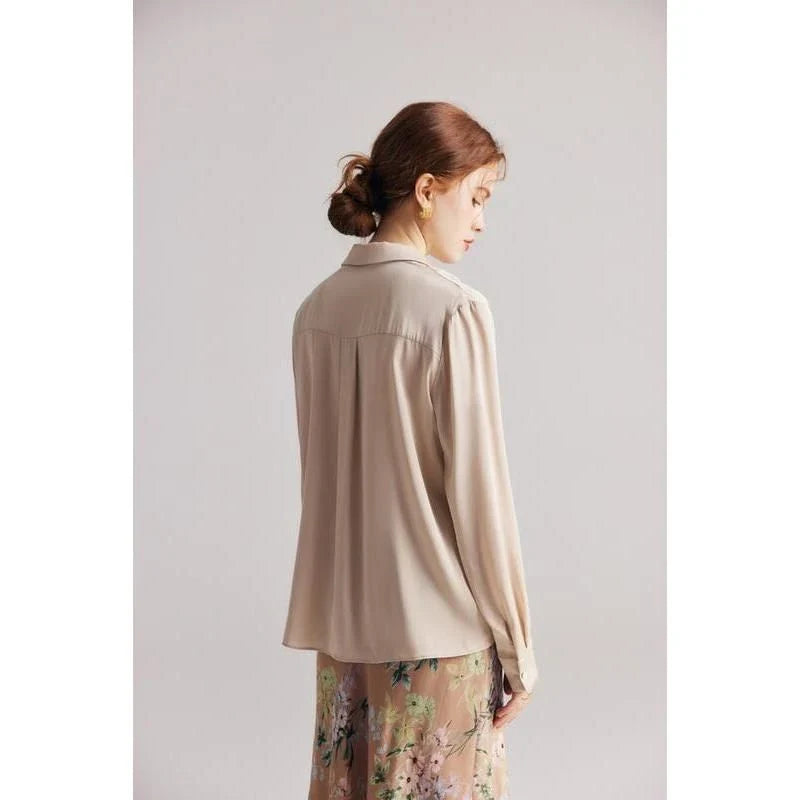 Elegant ruffled v-neck silk blouse in a champagne colour, featuring a straight and regular fit design for a timeless look.