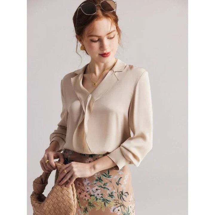Elegant ruffled v-neck silk blouse in a champagne colour, featuring a straight and regular fit design for a timeless look.