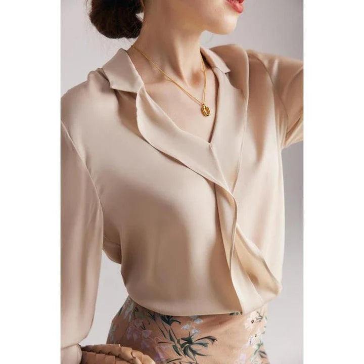 Elegant ruffled v-neck silk blouse in a champagne colour, featuring a straight and regular fit design for a timeless look.