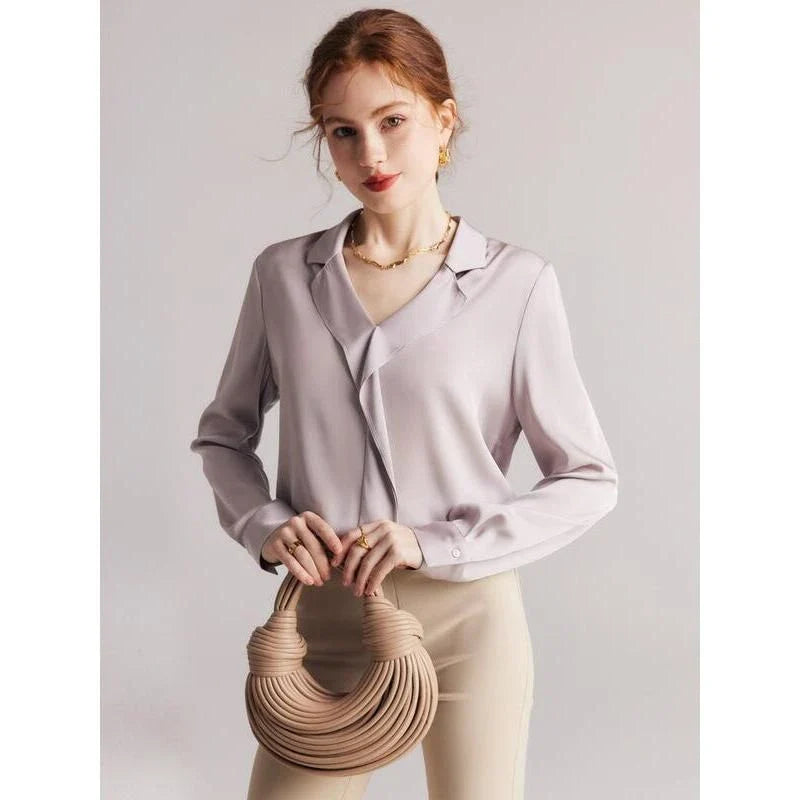 Elegant ruffled v-neck silk blouse in a champagne colour, featuring a straight and regular fit design for a timeless look.