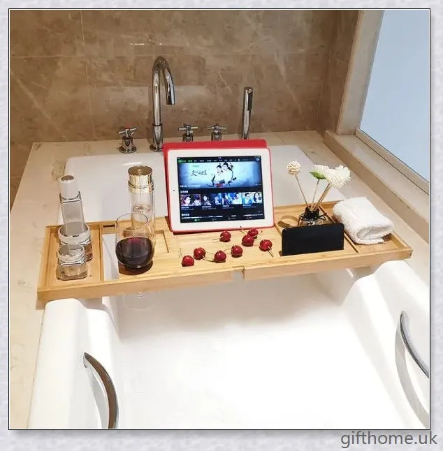 Bamboo bathtub storage rack with essential toiletries neatly arranged on the shelves