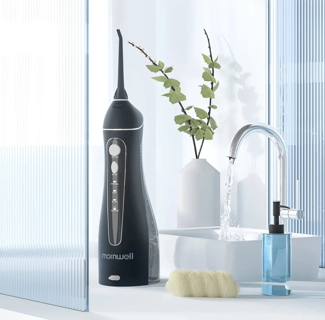 Rechargeable Portable Water Flosser with powerful pulse jet system and 200ml water tank for convenient, thorough cleaning