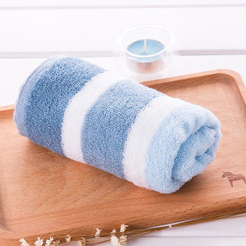 Luxurious cotton bath and face towel with brown, white, and blue striped design