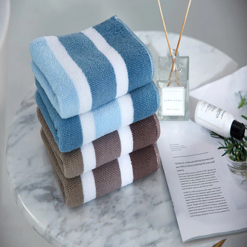 Luxurious cotton bath and face towel with brown, white, and blue striped design