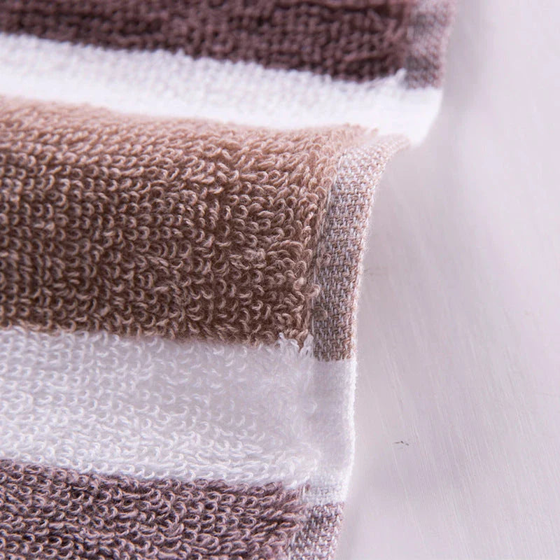 Luxurious cotton bath and face towel with brown, white, and blue striped design