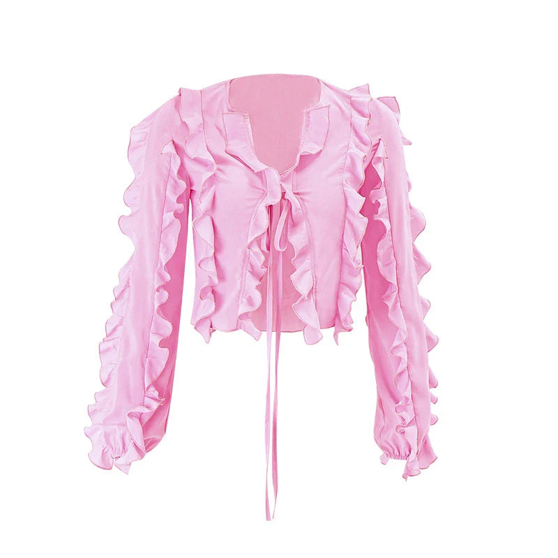 A girls' short top with a v-neck, ruffled trim, and a heart-shaped bow tie, made from stretchy chiffon fabric