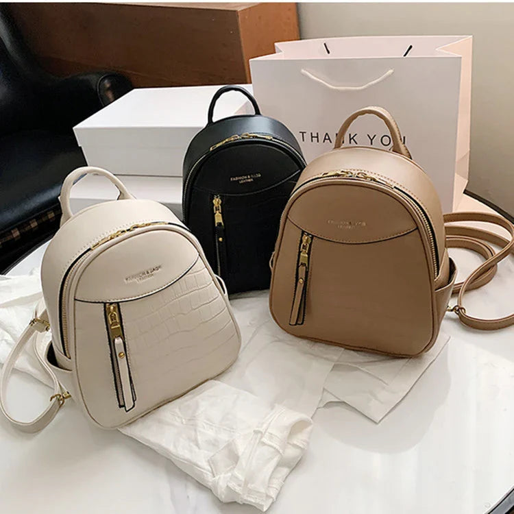 A chic and versatile all-match fashion small backpack in khaki, featuring a spacious square vertical design, premium PU leather construction, and polyester cotton lining for a timeless British-inspired look.