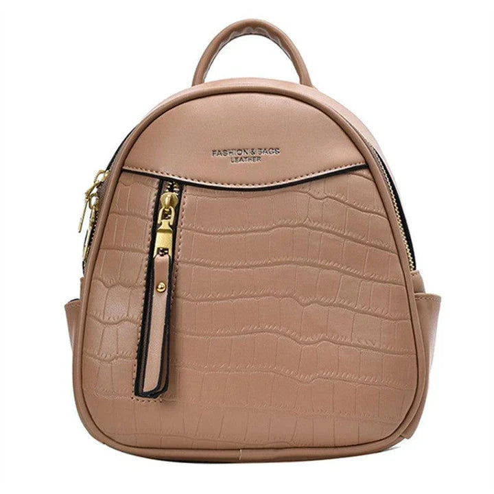 A chic and versatile all-match fashion small backpack in khaki, featuring a spacious square vertical design, premium PU leather construction, and polyester cotton lining for a timeless British-inspired look.