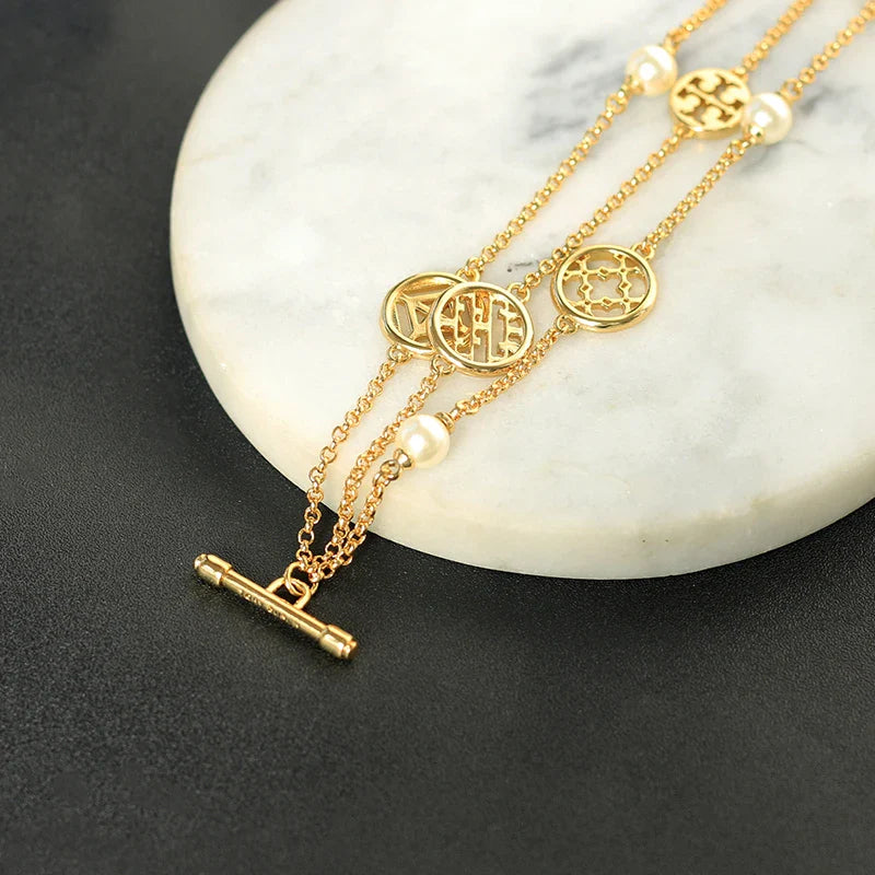 Elegant double hollow bracelet with a captivating cross, crown, or Roman numeral pattern, crafted with premium plated alloy materials.