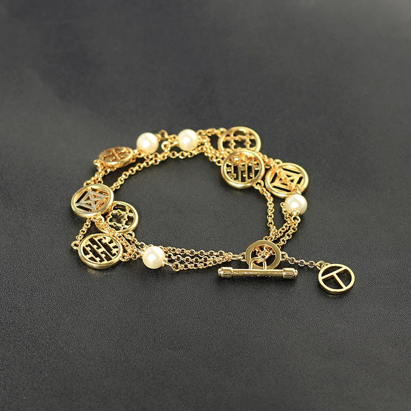 Elegant double hollow bracelet with a captivating cross, crown, or Roman numeral pattern, crafted with premium plated alloy materials.