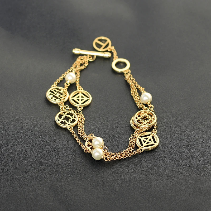 Elegant double hollow bracelet with a captivating cross, crown, or Roman numeral pattern, crafted with premium plated alloy materials.