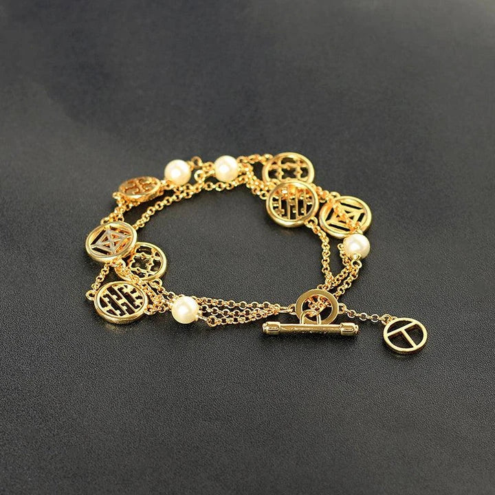Elegant double hollow bracelet with a captivating cross, crown, or Roman numeral pattern, crafted with premium plated alloy materials.