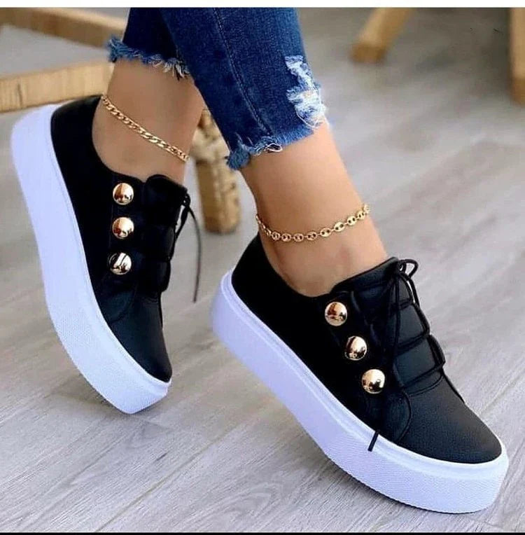 Lace-up flats sneakers for women with rivet detailing and a variety of colour options