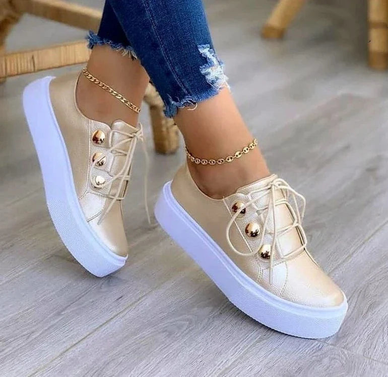 Lace-up flats sneakers for women with rivet detailing and a variety of colour options