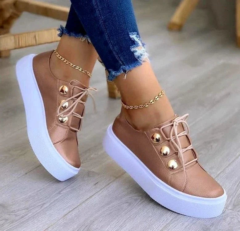 Lace-up flats sneakers for women with rivet detailing and a variety of colour options