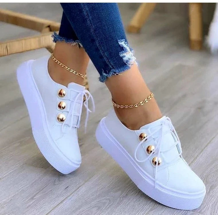 Lace-up flats sneakers for women with rivet detailing and a variety of colour options