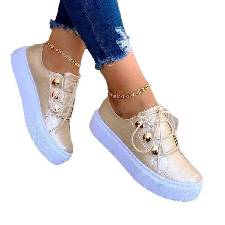 Lace-up flats sneakers for women with rivet detailing and a variety of colour options