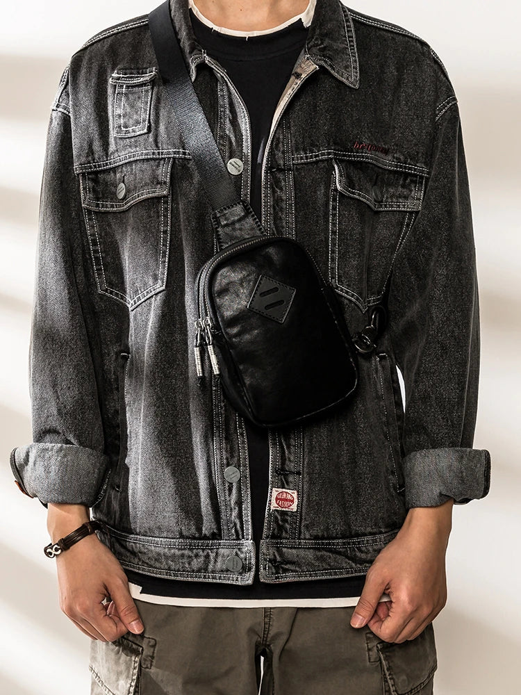 Stylish black leather chest bag with adjustable strap for modern urban gentlemen