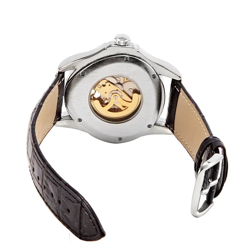 A stylish men's mechanical watch with a hollow triangle design, featuring a durable alloy case, genuine leather strap, and luminous display for easy reading.
