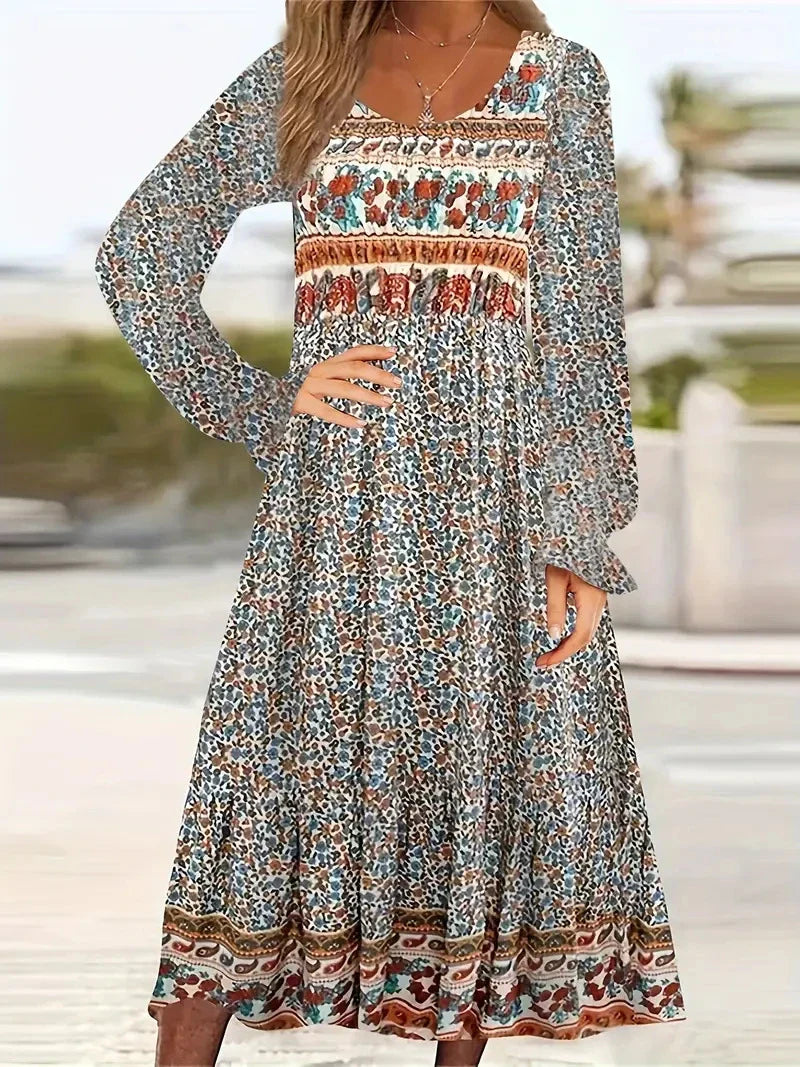 A beautifully printed dress with a round neckline, pullover design, and long sleeves in a variety of colours