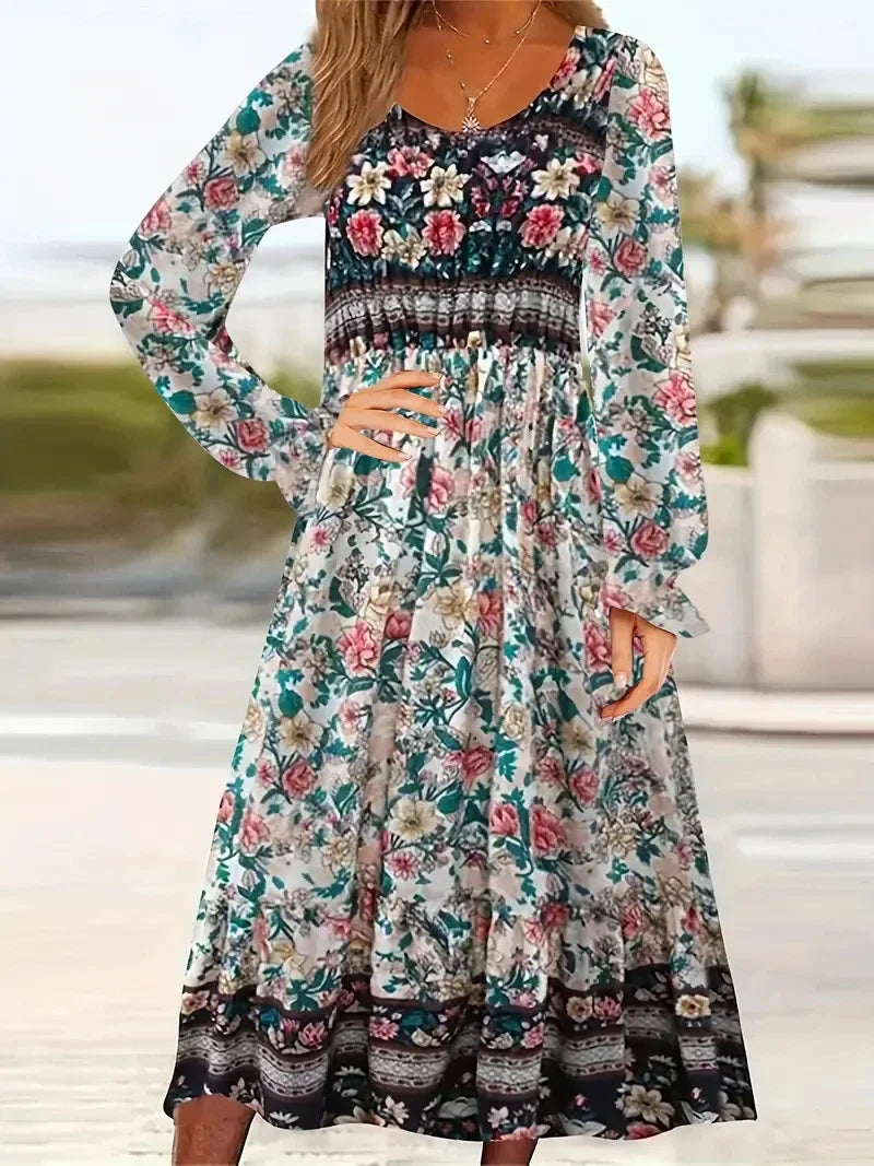 A beautifully printed dress with a round neckline, pullover design, and long sleeves in a variety of colours
