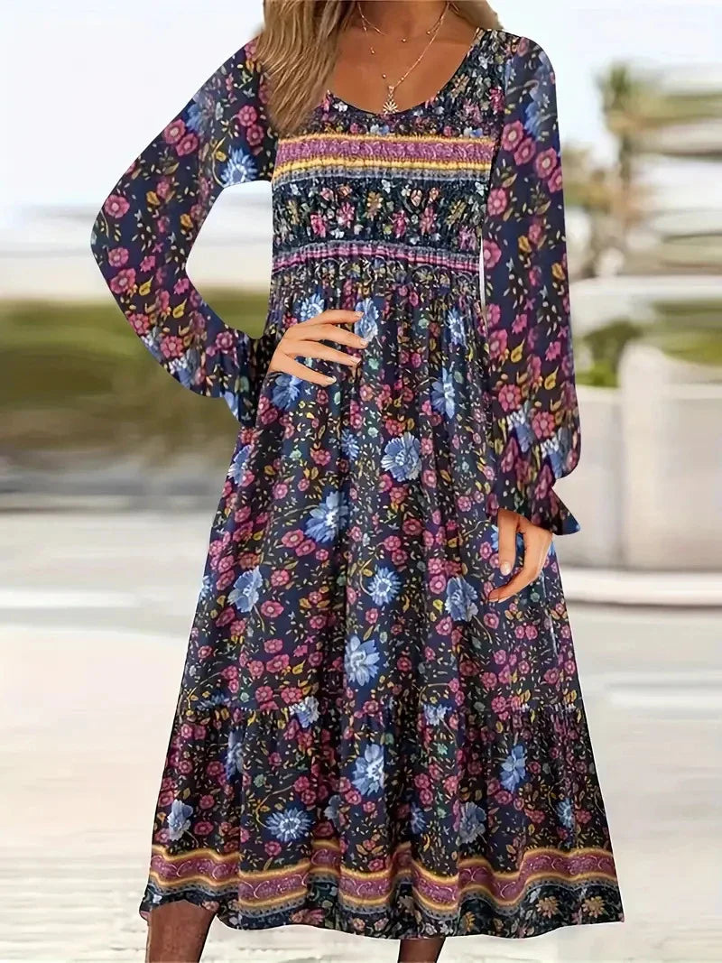 A beautifully printed dress with a round neckline, pullover design, and long sleeves in a variety of colours