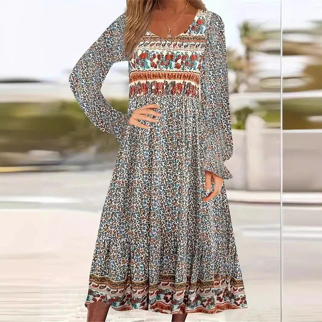 A beautifully printed dress with a round neckline, pullover design, and long sleeves in a variety of colours