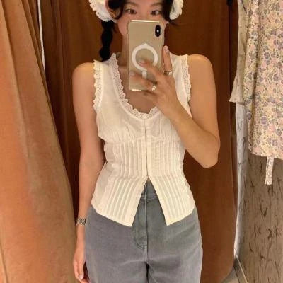Elegant white tank top with embroidered lace detailing and a sweet U-collar neckline, perfect for British-inspired casual and formal wear.